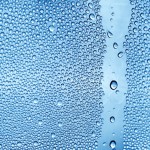 Water backgrounds with water drops. Blue water bubbles on window glass.