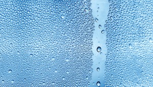 Water backgrounds with water drops. Blue water bubbles on window glass.